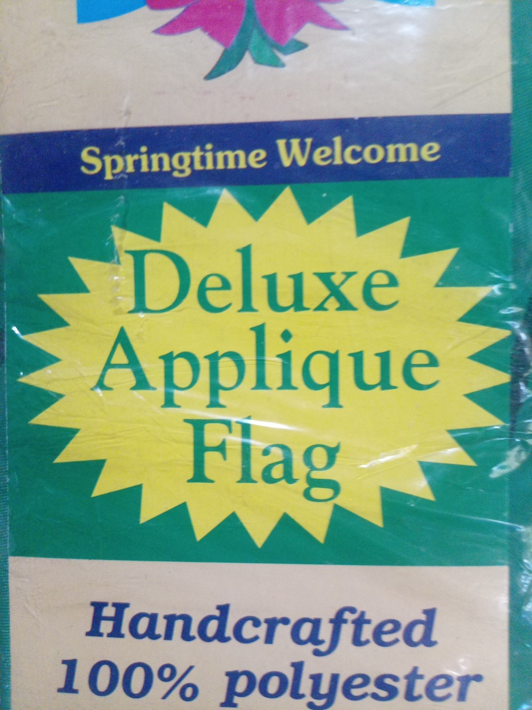 Pink yellow, red,and orange Tulip with green leaves in a bow(Welcome Flag) no po