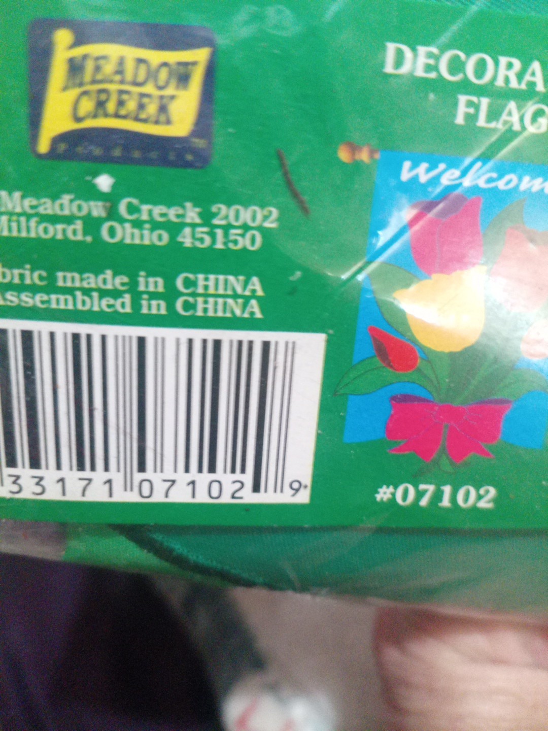Pink yellow, red,and orange Tulip with green leaves in a bow(Welcome Flag) no po